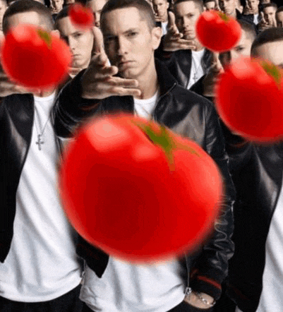 a group of men are holding tomatoes in front of their faces ..