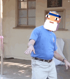 a man with a pixelated face on his head