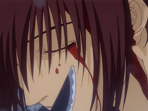 a close up of a man 's face with blood on it