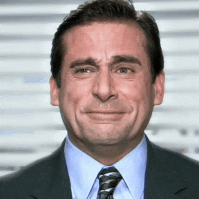 a man in a suit and tie is making a funny face