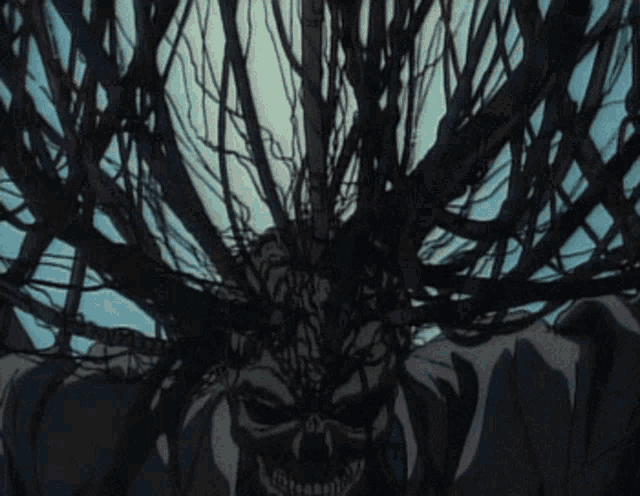 a skull is surrounded by branches and wires in a dark forest .