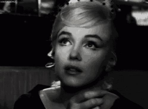 a close up of a woman 's face with vintageho written on the bottom