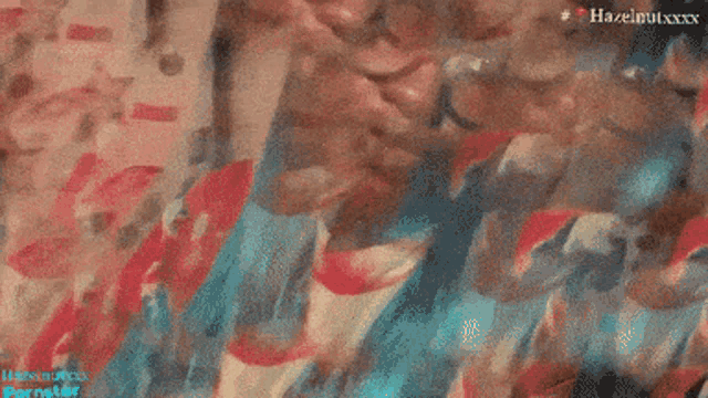 a close up of a person 's face with the words hazelnutxxx on the bottom right