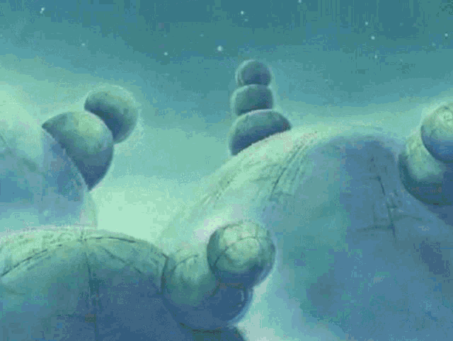 a close up of three blue balls on a blue surface