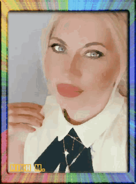 a picture of a woman in a white shirt and black tie with a rainbow border and the name michelle on the bottom