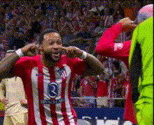 a soccer player wearing a red and white striped shirt with the number 3 on it