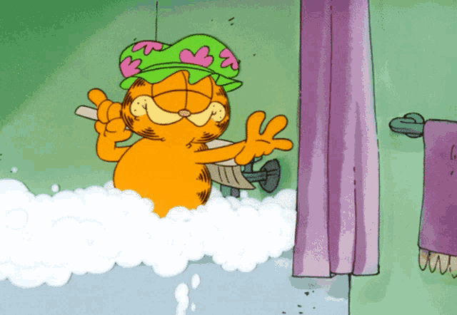 garfield is taking a bath in a bathtub