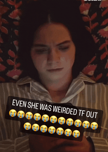 a woman laying on a bed with a sticker that says even she was weirded tf out