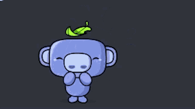 a cartoon monkey with a green leaf on its head