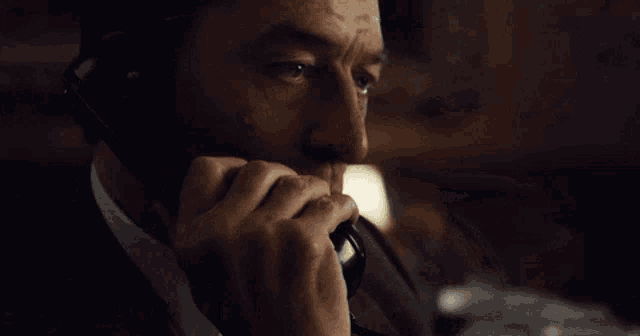 a man talking on a phone with the words " whatever you need me to do " next to him