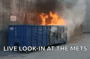 a dumpster is on fire with the words live look-in at the mets