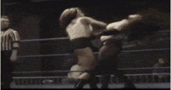a blurry picture of a boxing match with the word cccp on the ring