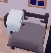 a bed with a blanket and a nightstand in a room with windows .