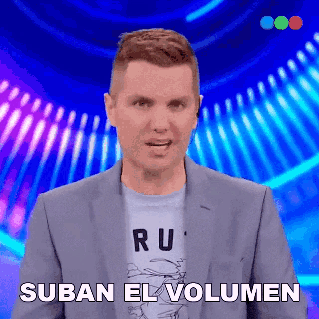 a man in a suit and a t-shirt with the word ru on it