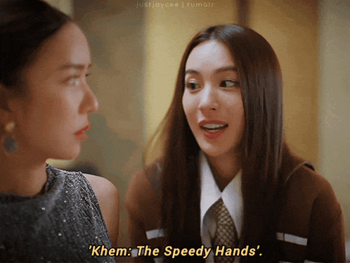 two women are talking to each other and one of them is saying " khem the speedy hands "