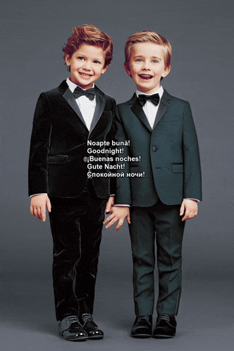 two young boys in tuxedos are standing next to each other and one of them says goodnight