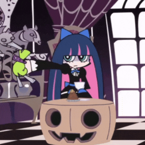 a cartoon character is sitting at a table with a pumpkin on it