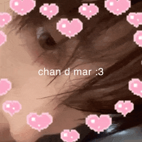 a close up of a person 's face with pink hearts around it and the words `` chan d mar '' .