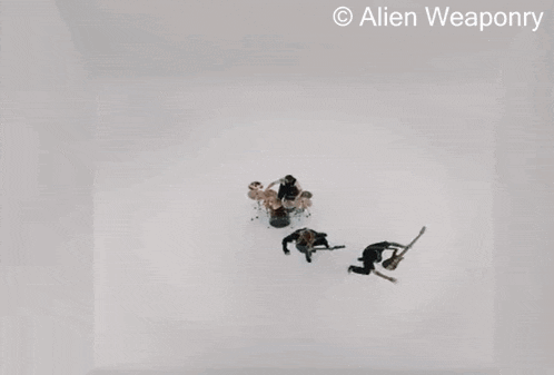 a man with dreadlocks is playing a guitar in front of a white wall with the words alien weaponry above him