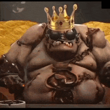 a cartoon character wearing a crown and sunglasses is sitting on a table .