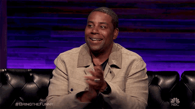 a man sitting on a couch with the hashtag bringthefunny