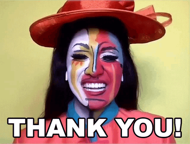 a woman wearing a red hat has her face painted in different colors and says thank you