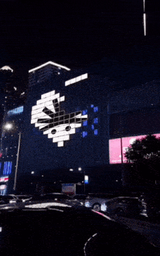 a building with a heart shaped display on the side of it