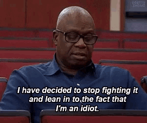 a man wearing glasses is sitting in an auditorium and saying i have decided to stop fighting