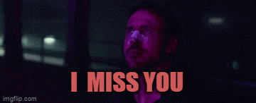 a man in a dark room with the words i miss you on the bottom