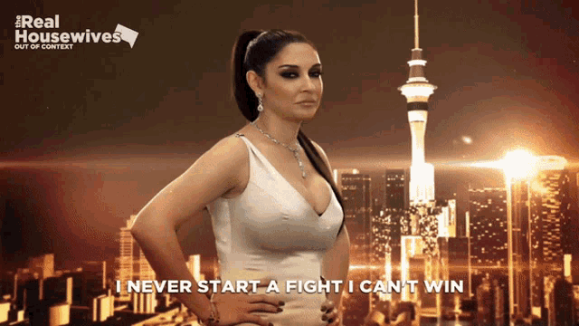 a poster for real housewives shows a woman standing in front of a city skyline