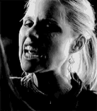 a black and white photo of a woman with a ponytail screaming .
