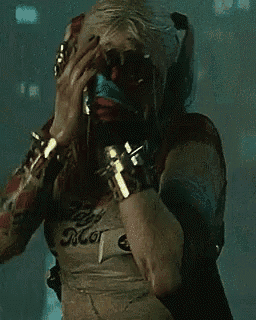 harley quinn is wearing a shirt that says daddy 's little monster