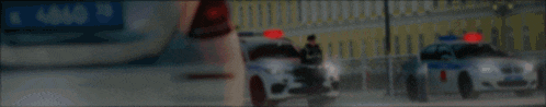 a poster for maxim freeman mta province # 2 with a police car in the background