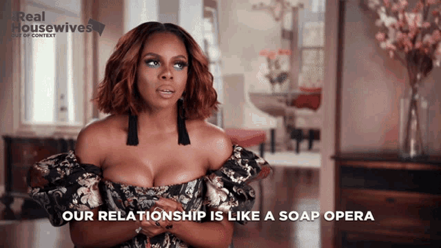 a real housewives advertisement shows a woman in a floral dress
