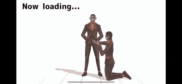 a man in a suit kneeling down next to another man in a suit
