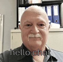 a man with a mustache and the words hello chat on his face