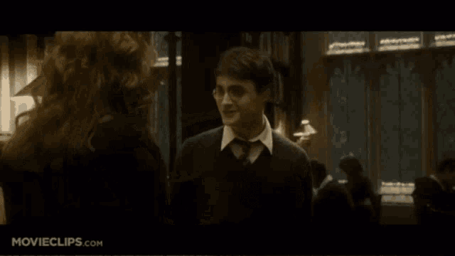 a movie clip from movieclips.com shows a man and woman in a library