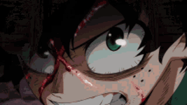 a close up of a person 's face with blood coming out of his eyes .