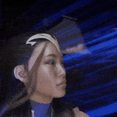 a close up of a woman 's face with a blue background and a watermark that says krimsunm