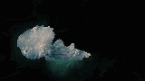 a silhouette of a person swimming in a pool of water .