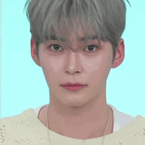 a close up of a person 's face with a smiley face behind them