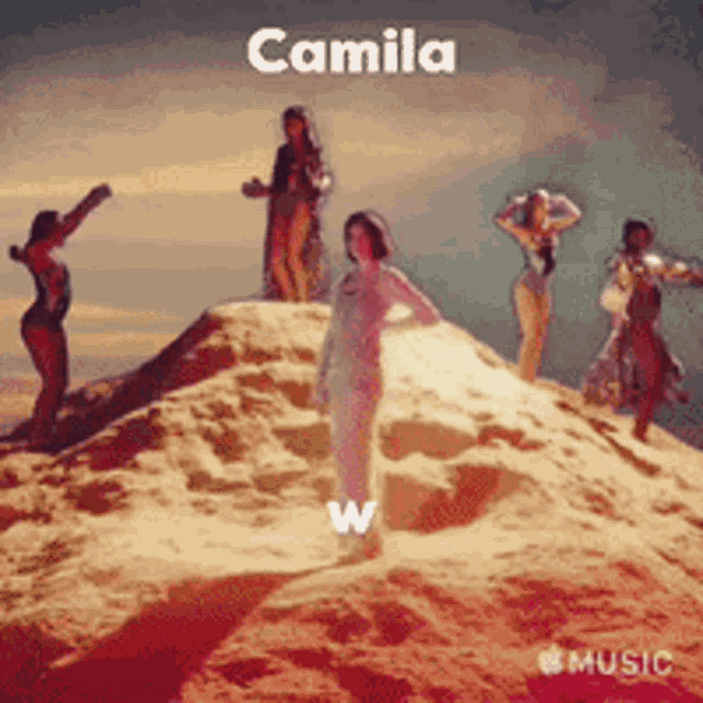 a group of women are standing on top of a sandy hill with camila written on the bottom