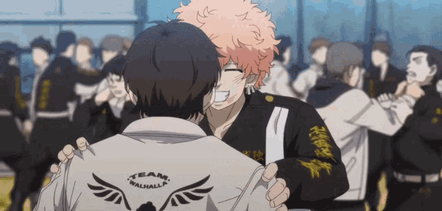 two anime characters are hugging and one has a shirt that says team walhalla