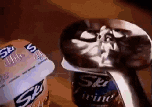 a can of ski wine sits next to a skull