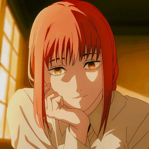 a girl with red hair has her hand on her face