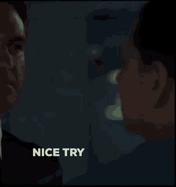 a blurred image of a person with the words nice try written on the bottom