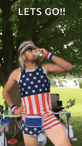 a man in an american flag outfit drinking from a can