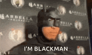 a man in a batman costume is saying i 'm blackman .