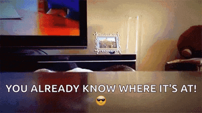 a picture of a person sitting in front of a tv with the words " you already know where it 's at "