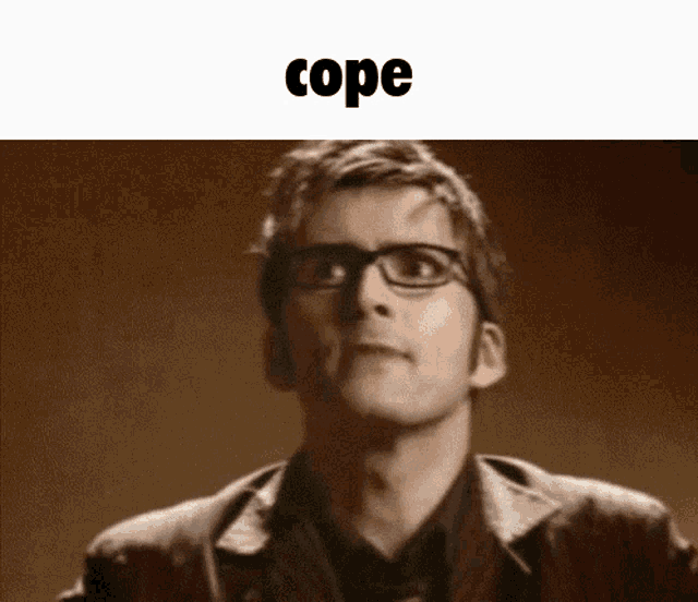 a man wearing glasses and a jacket is looking up at the word cope